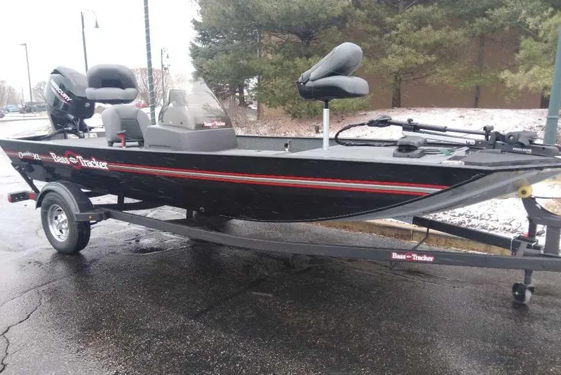 The Image of 2026 Tracker Bass Tracker Classic XL boat on trailer, parked outdoors in snowy setting. - 0