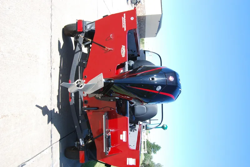 Slide: The Image of 2026 Tracker Targa V-18 WT boat with powerful outboard motor on a trailer. - 2