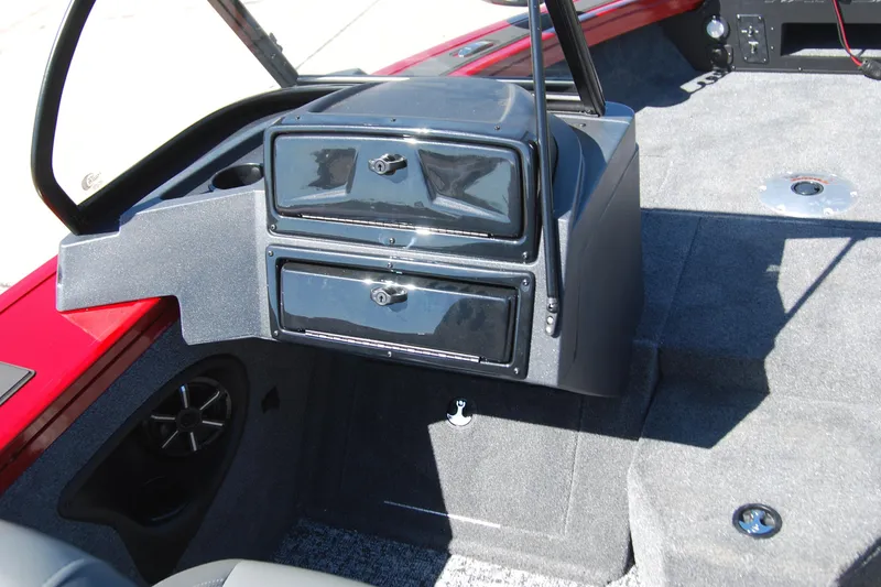 Slide: The Image of 2026 Tracker Targa V-18 WT boat interior with storage compartments and speaker. - 5