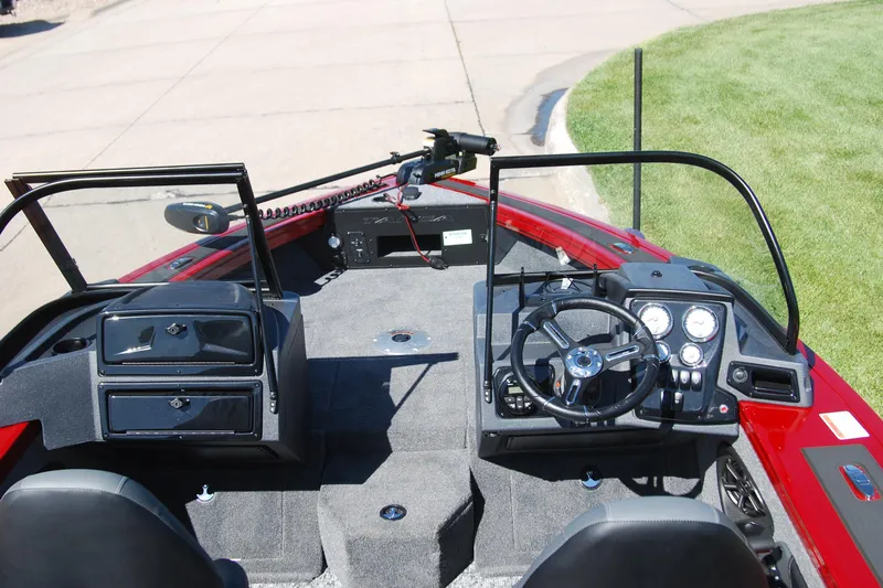 Slide: The Image of Interior view of 2026 Tracker Targa V-18 WT boat, featuring steering console and dashboard. - 7