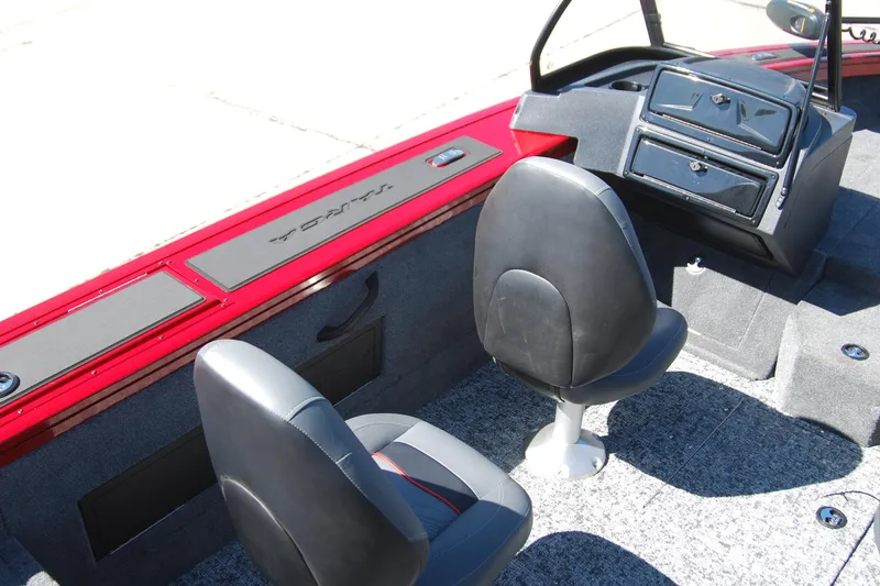 Slide: The Image of 2026 Tracker Targa V-18 WT boat interior with black seats and red trim. - 8