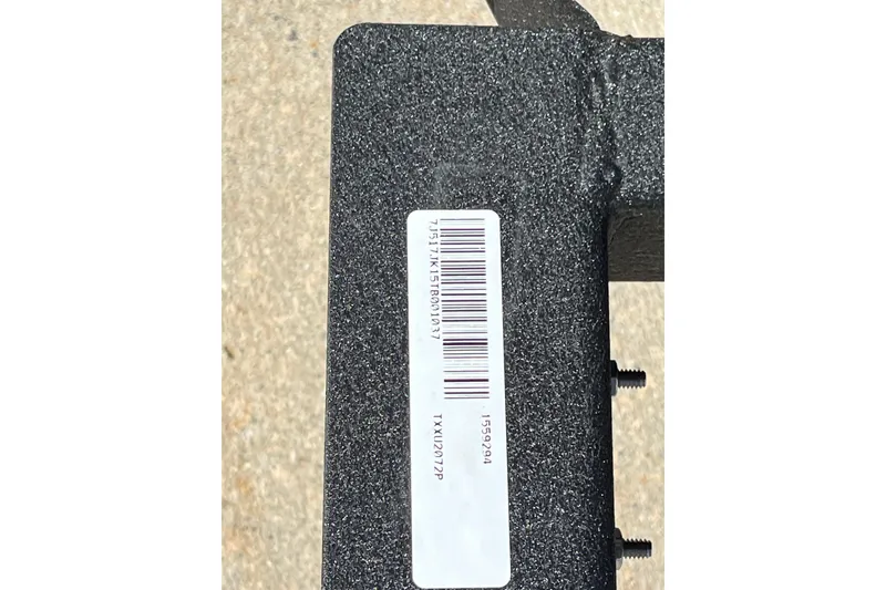Slide: The Image of Barcode label on Tracker Grizzly 2072 Utility, 2026 model, textured surface. - 8