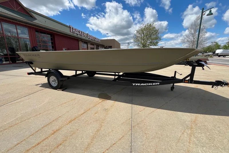 Slide: The Image of 2026 Tracker Grizzly 2072 Utility boat on trailer outside Tracker Boat Center. - 9