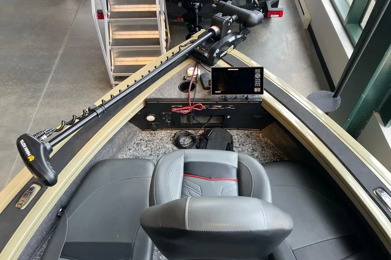 Slide: The Image of 2026 Tracker Targa V-18 Combo boat interior with advanced navigation system and comfortable seating. - 2