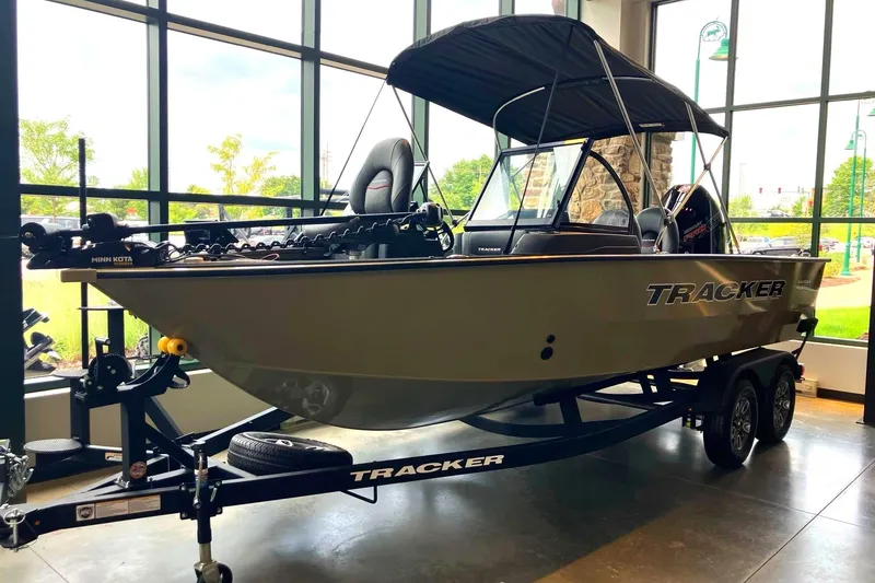 The Image of A 2026 Tracker Targa V-18 Combo boat on a trailer in a showroom. - 0