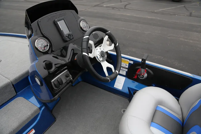 Slide: The Image of 2026 Nitro Z17 boat cockpit with steering wheel, gauges, and seating. - 4