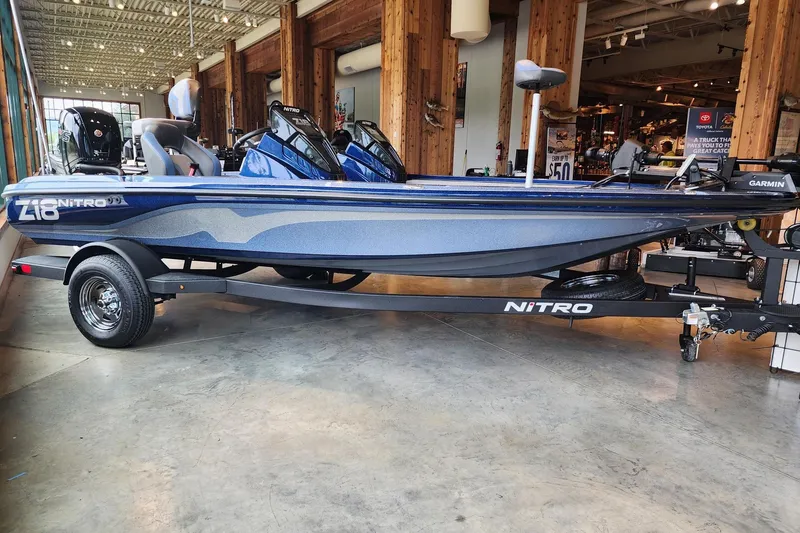 The Image of 2026 Nitro Z18 Pro boat displayed indoors, featuring sleek design and modern equipment. - 0