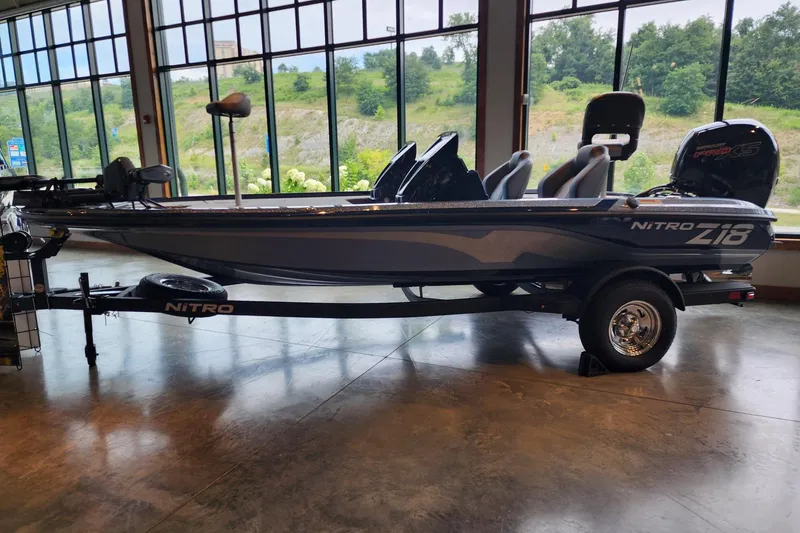 Slide: The Image of 2026 Nitro Z18 Pro boat displayed indoors with large windows in the background. - 1