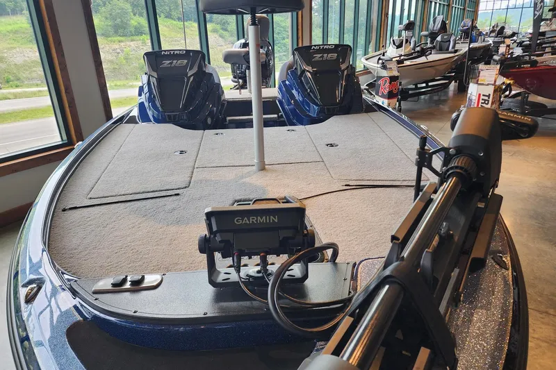 Slide: The Image of 2026 Nitro Z18 Pro boat with Garmin equipment in showroom. - 2