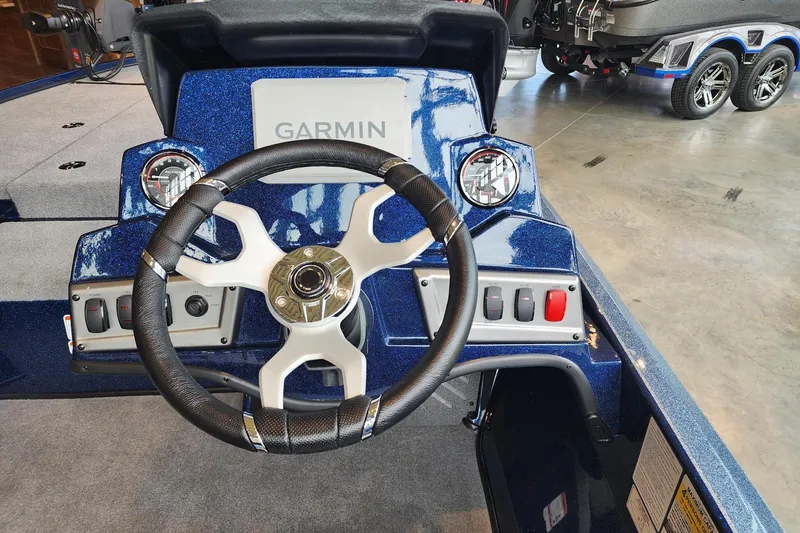 Slide: The Image of Steering wheel and dashboard of 2026 Nitro Z18 Pro boat with Garmin display. - 4