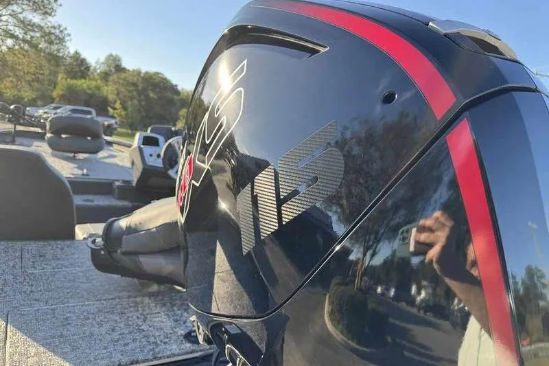 Slide: The Image of 2026 Tracker Pro Team 190 boat engine with sleek black and red design. - 14