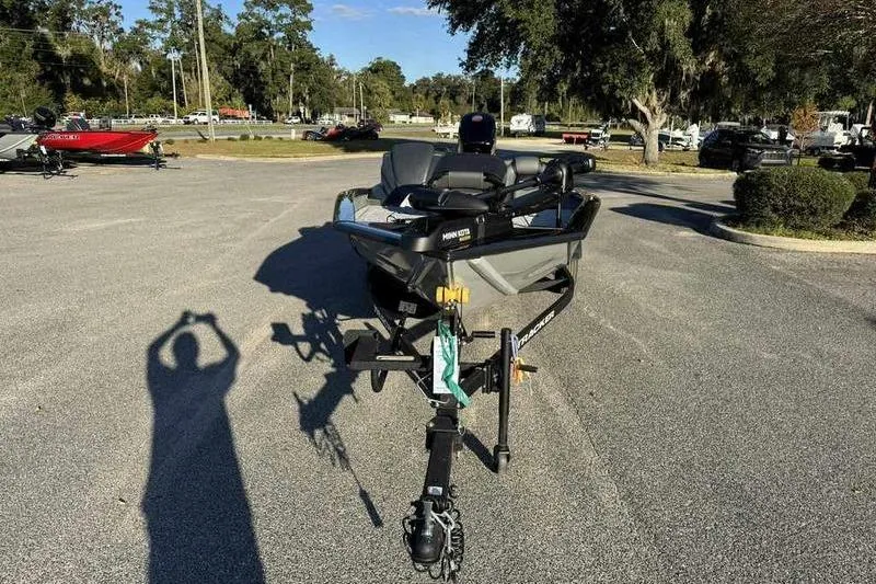 Slide: The Image of 2026 Tracker Pro Team 190 boat on trailer in parking lot, sunny day. - 5
