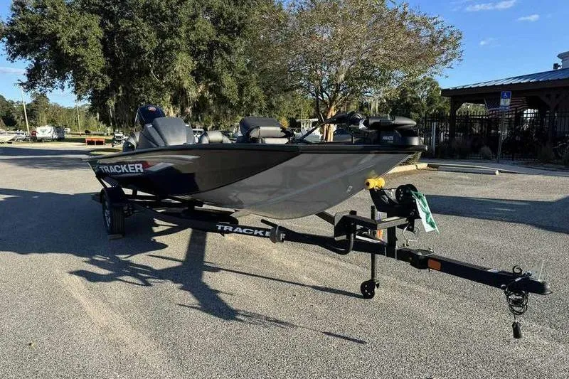 Slide: The Image of 2026 Tracker Pro Team 190 boat on trailer in sunny parking lot. - 6