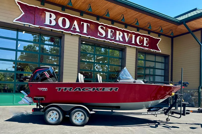 The Image of 2026 Tracker Targa V-18 Combo boat on trailer outside boat service center. - 0