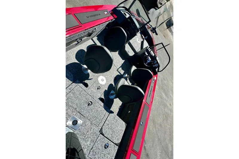 Slide: The Image of 2026 Tracker Targa V-18 Combo boat interior with seating and control panel. - 2