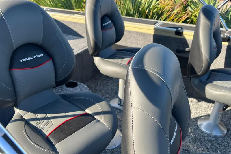 Slide: The Image of 2026 Tracker Targa V-18 WT boat interior with seating and storage compartments. - 4