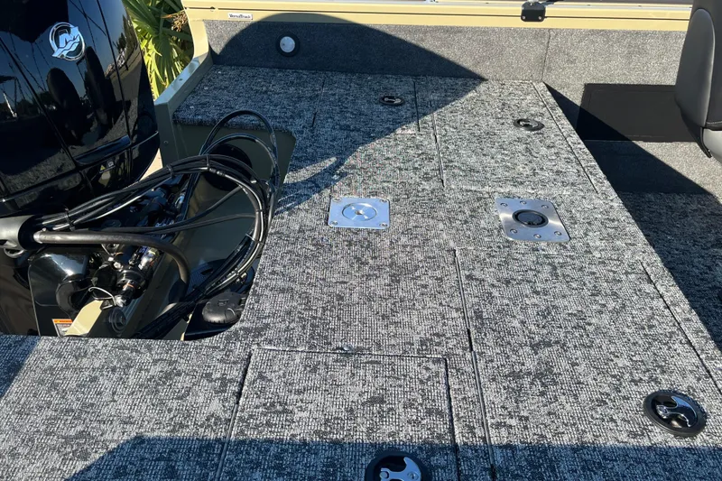 Slide: The Image of 2026 Tracker Targa V-18 WT boat interior with sleek seating and dashboard design. - 5