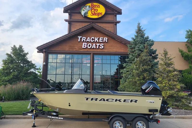 The Image of 2026 Tracker Targa V-18 Combo boat displayed outside Bass Pro Shops. - 0