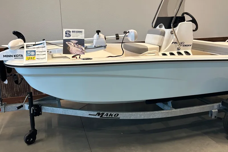 The Image of 2026 Mako Pro Skiff 13 CC boat on display with Minn Kota Maxxum motor. - 0