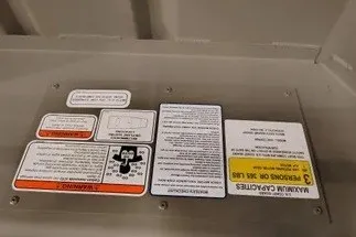 Slide: The Image of Warning labels on 2026 Tracker Grizzly 12 Jon boat interior. - 34