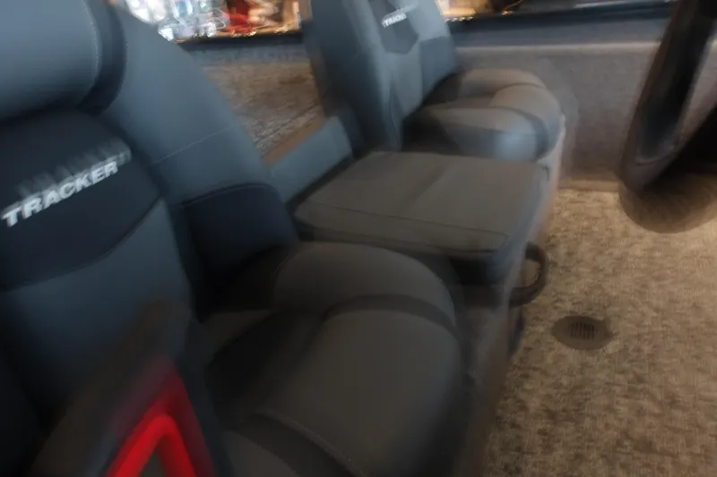 Slide: The Image of Interior seating of 2026 Tracker Pro Team 190 boat, featuring gray cushioned seats. - 16