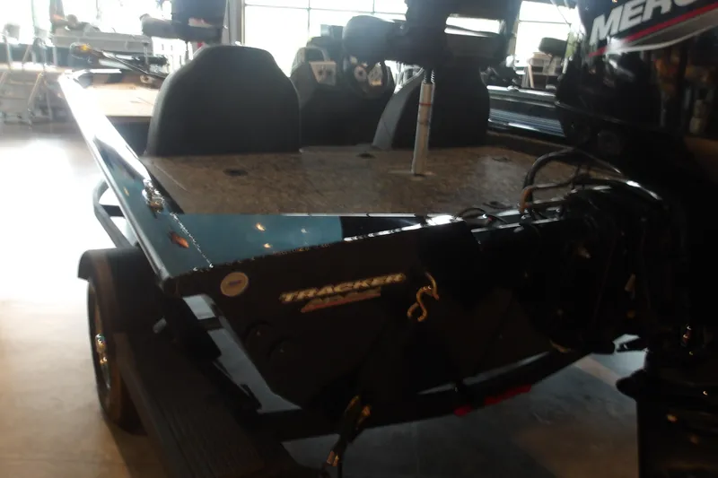 Slide: The Image of 2026 Tracker Pro Team 190 boat with Mercury engine in showroom. - 10