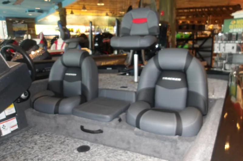 Slide: The Image of 2026 Tracker Pro Team 190 boat interior with gray seating and steering wheel. - 7
