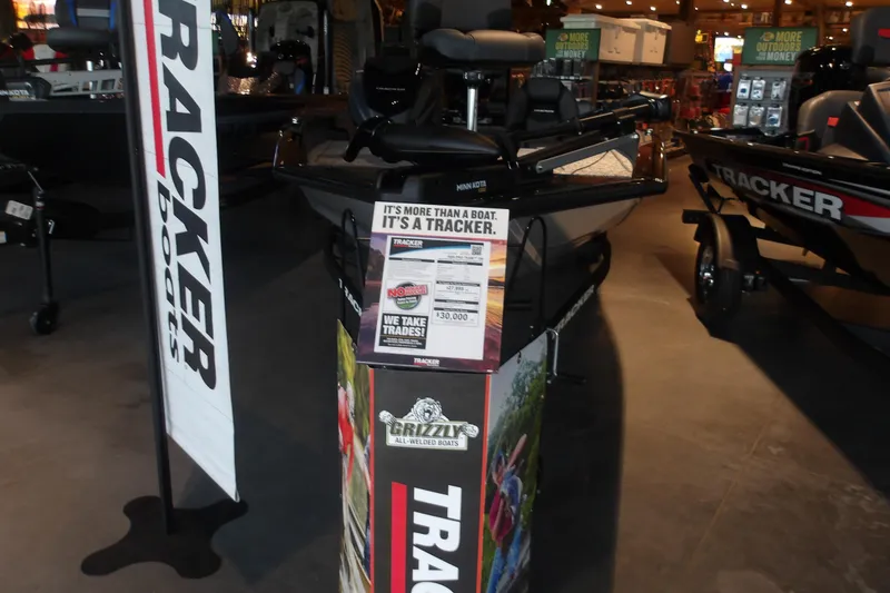 The Image of 2026 Tracker Pro Team 190 boat displayed indoors with promotional signage. - 3