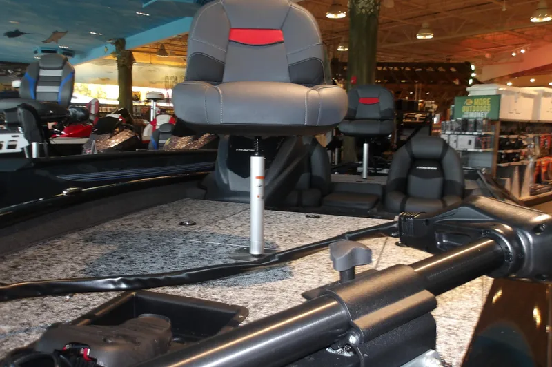 Slide: The Image of 2026 Tracker Pro Team 190 boat interior with seating and equipment in showroom. - 5