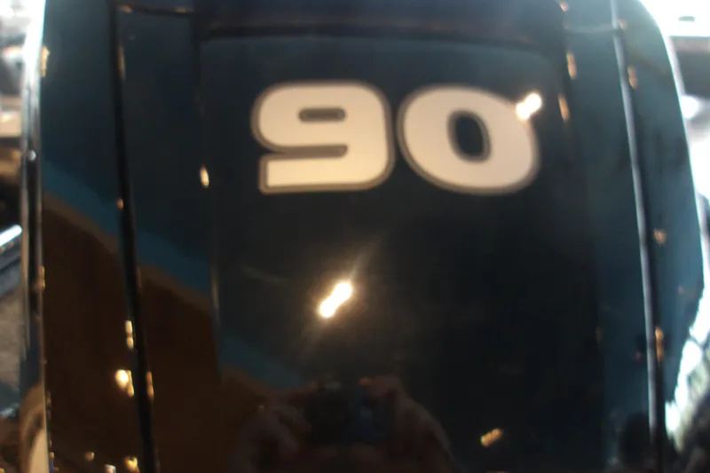 Slide: The Image of Close-up of 2026 Tracker Pro Team 190 boat engine with '90' decal. - 9