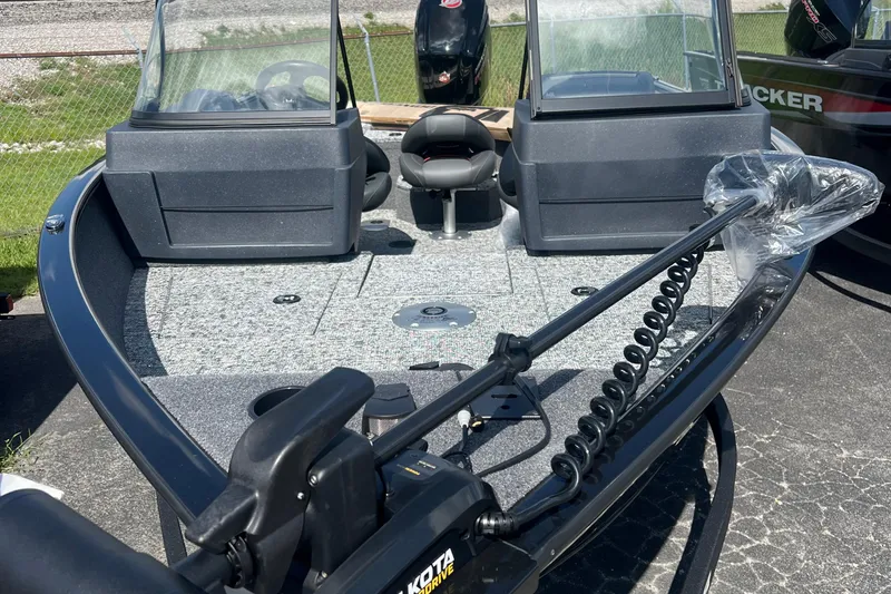 Slide: The Image of 2026 Tracker Pro Guide V-175 WT boat with trolling motor and dual consoles. - 2