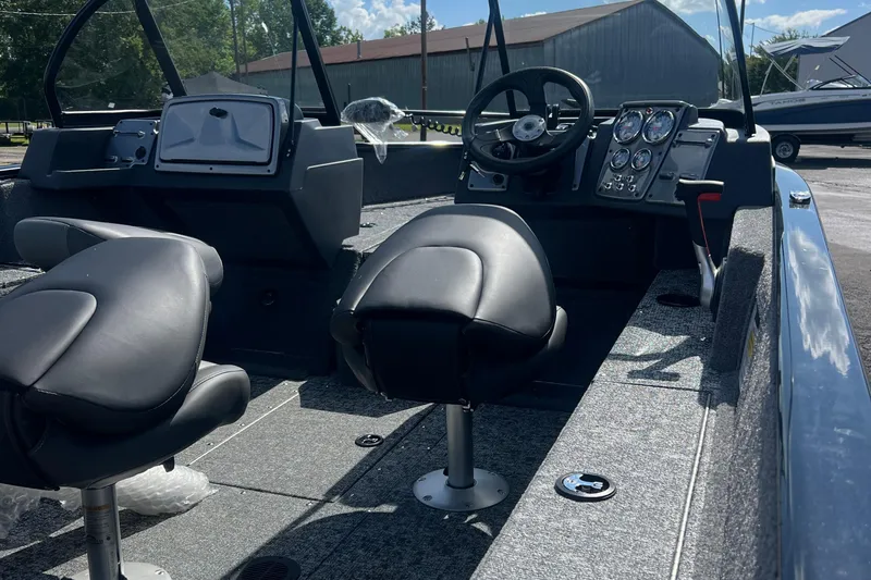 Slide: The Image of Interior of 2026 Tracker Pro Guide V-175 WT boat with modern dashboard and seating. - 3