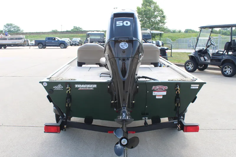 Slide: The Image of 2026 Tracker Bass Tracker Classic Limited boat with outboard motor, parked on trailer. - 6