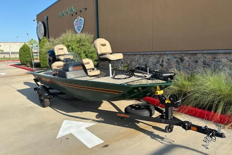 Slide: The Image of 2026 Tracker Bass Tracker Classic Limited boat on trailer, parked outdoors. - 2
