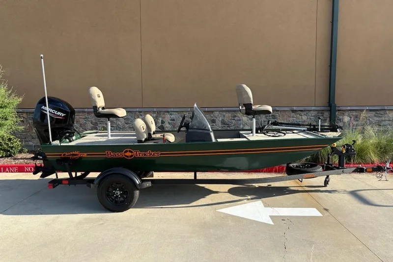 Slide: The Image of 2026 Tracker Bass Tracker Classic Limited boat on trailer, parked outdoors. - 3
