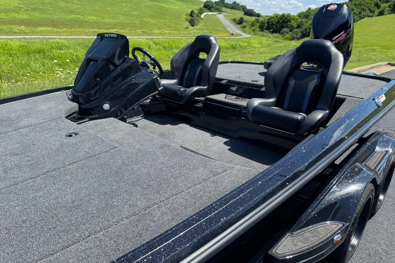 Slide: The Image of 2026 Nitro Z20 XL Pro boat with sleek design, dual seats, and spacious deck on a sunny day. - 5