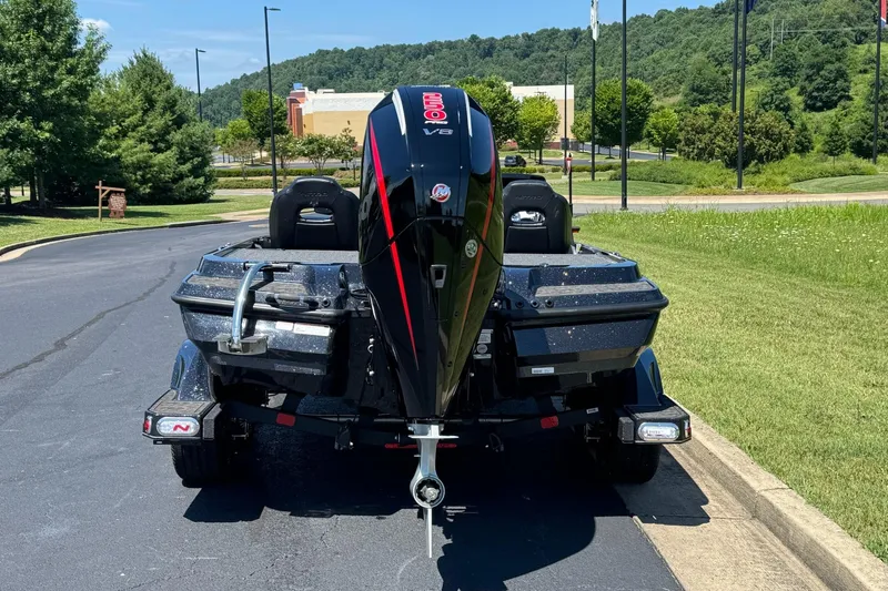 Slide: The Image of 2026 Nitro Z20 XL Pro boat with powerful outboard motor, parked on a sunny day. - 7