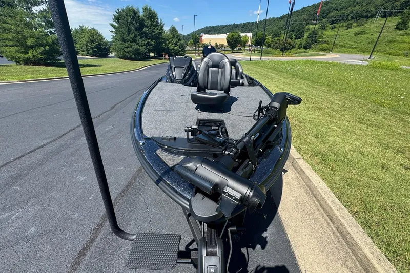 Slide: The Image of 2026 Nitro Z20 XL Pro fishing boat on a sunny day, parked on pavement. - 8