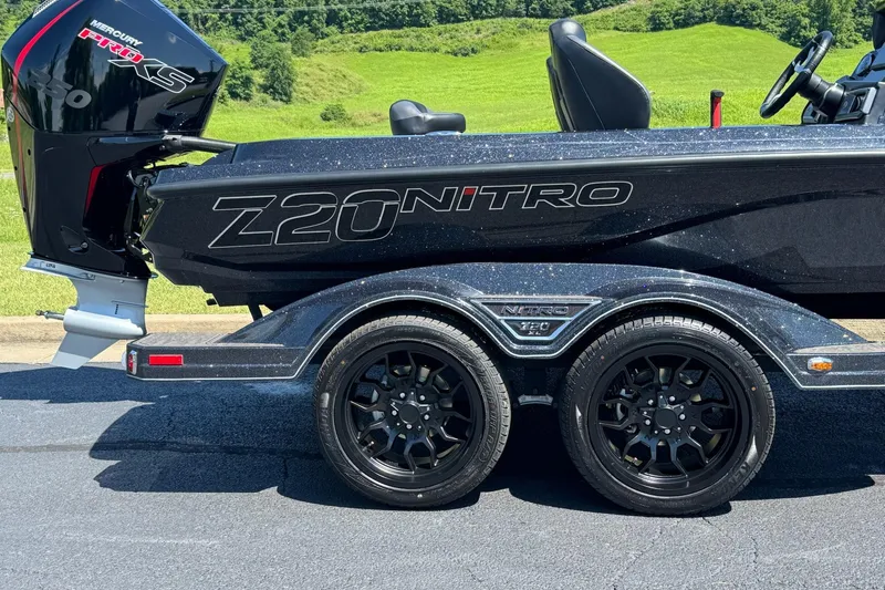 Slide: The Image of 2026 Nitro Z20 XL Pro boat with Mercury Pro XS engine on a trailer. - 9