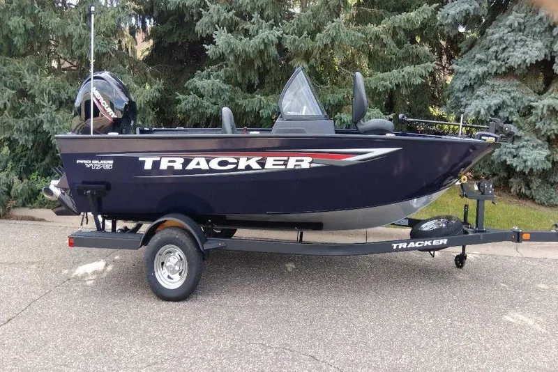 The Image of 2026 Tracker Pro Guide V-175 WT boat on trailer, parked outdoors. - 0