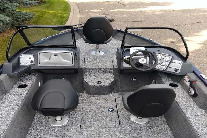Slide: The Image of 2026 Tracker Pro Guide V-175 WT boat interior with steering wheel and seating. - 4