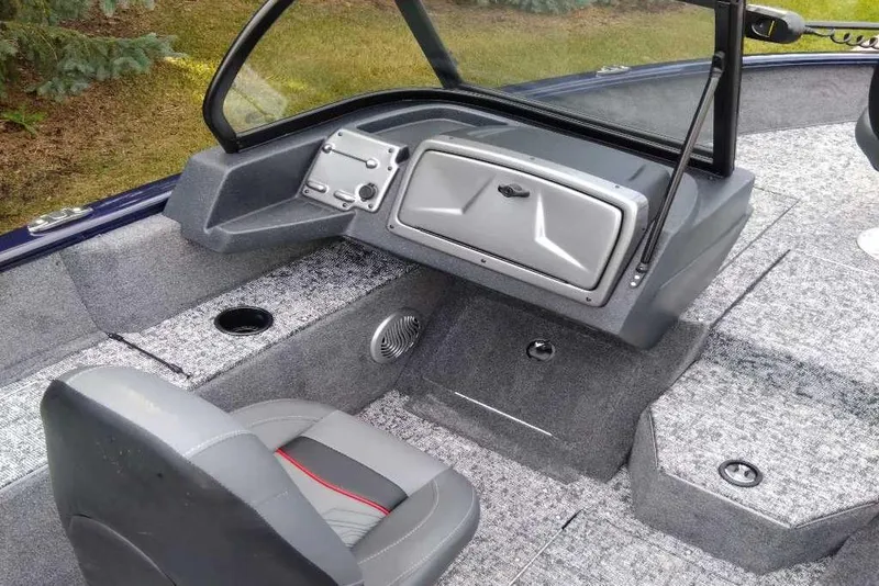 Slide: The Image of 2026 Tracker Pro Guide V-175 WT boat interior with gray seating and storage compartments. - 5