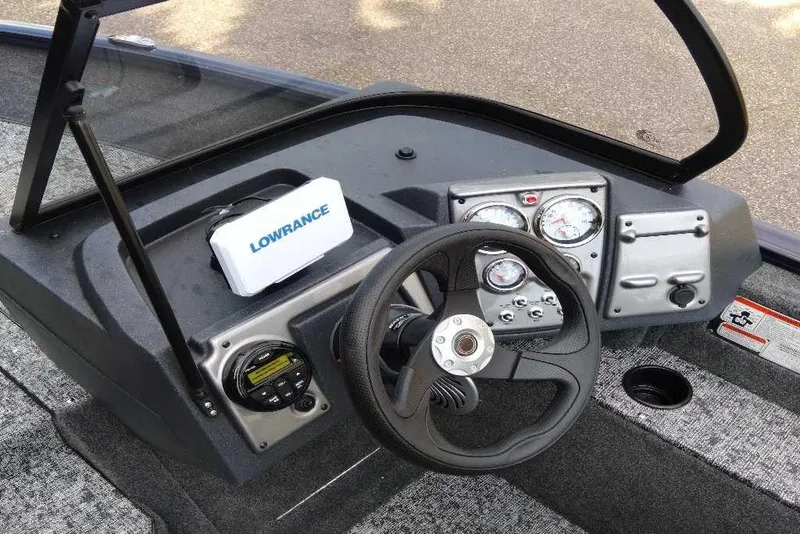 Slide: The Image of 2026 Tracker Pro Guide V-175 WT boat dashboard with Lowrance electronics and steering wheel. - 6