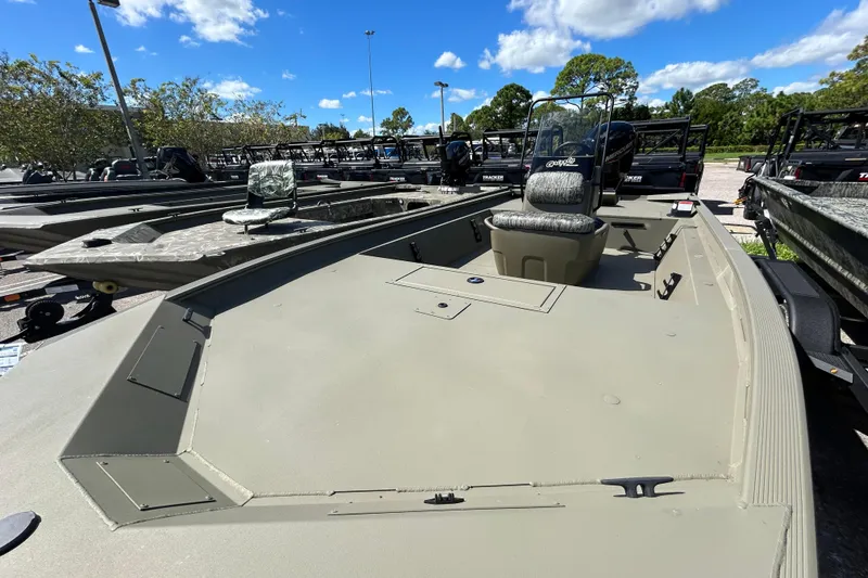 Slide: The Image of 2026 Tracker Grizzly 1860 CC boat in outdoor showroom, sunny day, clear sky. - 4