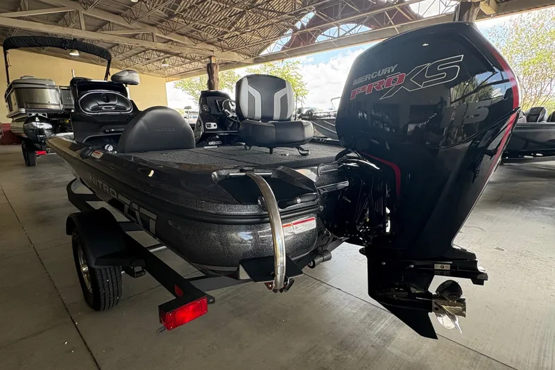 Slide: The Image of 2026 Nitro Z17 boat with Mercury Pro XS engine in a covered area. - 5