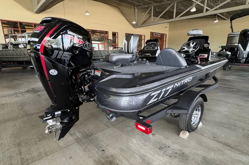 Slide: The Image of 2026 Nitro Z17 boat with powerful outboard motor in a showroom setting. - 1