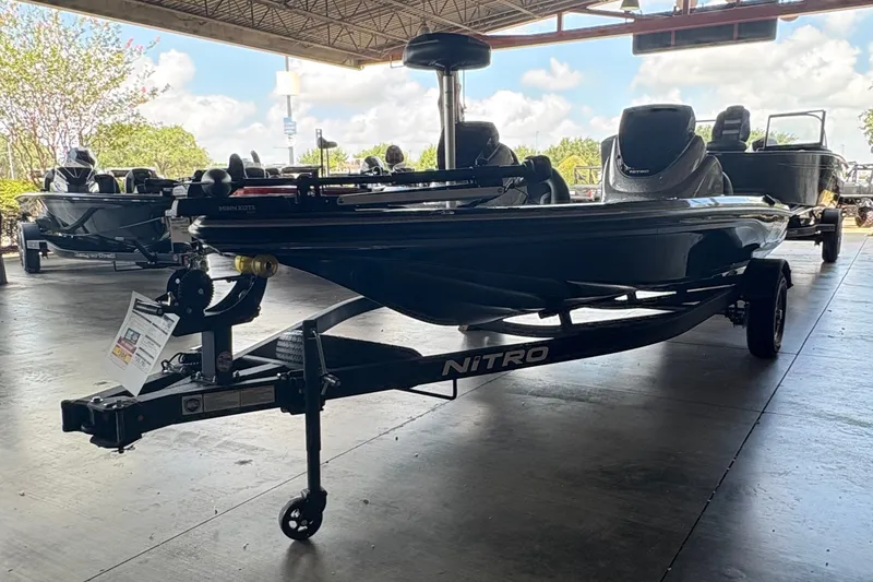 Slide: The Image of 2026 Nitro Z17 boat on trailer in a spacious indoor showroom. - 3