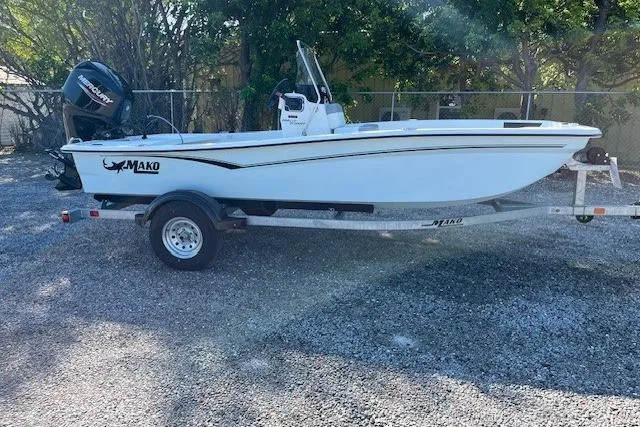 The Image of 2026 Mako Pro Skiff 15 CC boat on trailer, parked outdoors. - 0