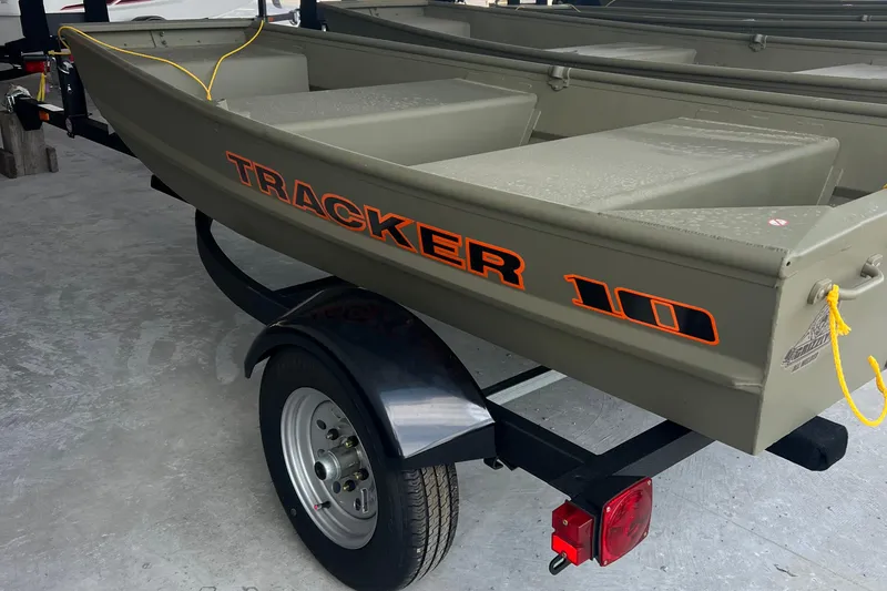 The Image of 2026 Tracker Grizzly 10 Jon boat on trailer, featuring durable design and bold lettering. - 0