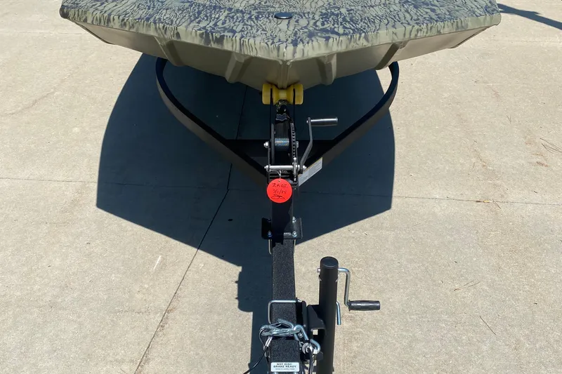 Slide: The Image of 2026 Tracker Grizzly 1860 CC boat on trailer, viewed from the front. - 2